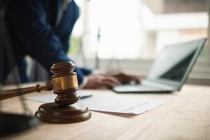 A judge gavel is prepared in the courtroom to be used to give a signal when the verdict is read after the trial is completed. Concept judge gavel is prepared to symbolize the decision in a court case. photo