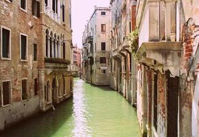 Canal in Venice, Italy. Exquisite buildings along Canals. photo