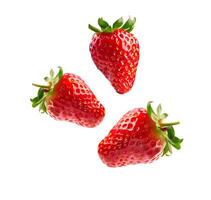 Levitation strawberries on white backgrounds photo