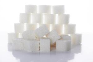 sugar cubes on white photo