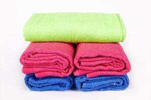 stacked towels on white photo