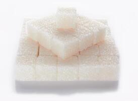 sugar cubes on white photo