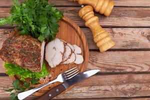 Baked meat on wooden surface photo