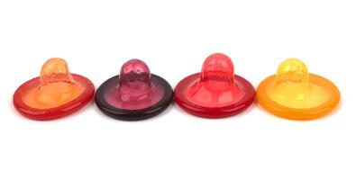 Colorful condoms isolated photo