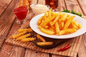 french fries on wooden table photo