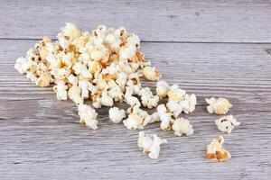 Popcorn on wooden background photo