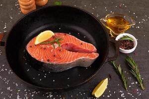 Salmon steak on pan photo