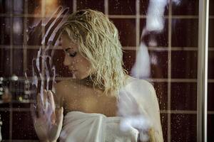 Sexy blonde girl with wet hair in the bathroom photo