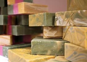 Multicolored Hand Cut Artisan Soaps on Display at a Market photo