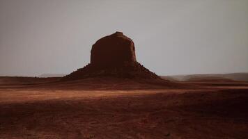 A large rock in the middle of a desert video