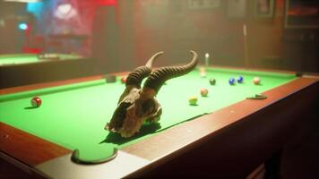 A long horn bull skull on a pool table video