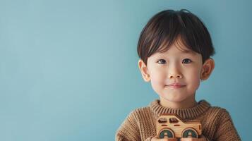 AI generated Little boy hugging car toy on pastel blue background photo