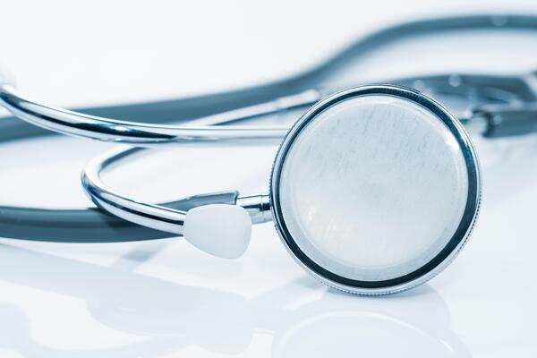 Close up Medical stethoscope for doctor checkup on table