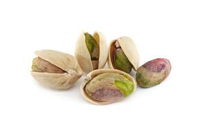 Pistachio nuts in shell isolated on white background photo