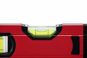 Red spirit level with bubble indicator isolated on white photo