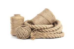 Rolls of natural jute rope and twine isolated on white photo