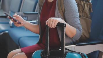 Asian young woman using laptop sitting near windows at first class on airplane during flight,Traveling and Business concept video