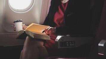 Asian young woman using laptop sitting near windows at first class on airplane during flight,Traveling and Business concept video