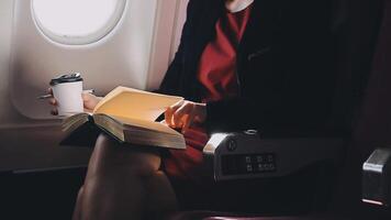 Asian young woman using laptop sitting near windows at first class on airplane during flight,Traveling and Business concept video