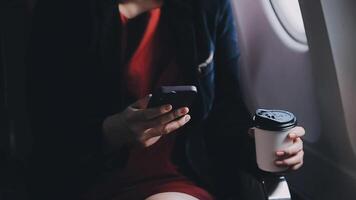 Asian young woman using laptop sitting near windows at first class on airplane during flight,Traveling and Business concept video