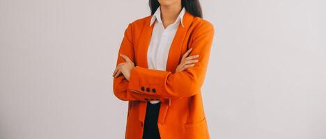 Asian Business woman using calculator and laptop for doing math finance on an office desk, tax, report, accounting, statistics, and analytical research concept photo