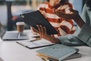 Finance manager meeting discussing company growth project success financial statistics, professional investor working start up project for strategy plan with document, laptop and digital tablet. photo