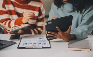 Finance manager meeting discussing company growth project success financial statistics, professional investor working start up project for strategy plan with document, laptop and digital tablet. photo
