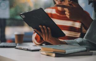 Finance manager meeting discussing company growth project success financial statistics, professional investor working start up project for strategy plan with document, laptop and digital tablet. photo