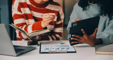 Finance manager meeting discussing company growth project success financial statistics, professional investor working start up project for strategy plan with document, laptop and digital tablet. photo