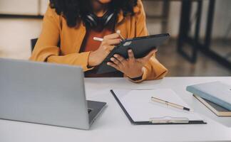 Finance manager meeting discussing company growth project success financial statistics, professional investor working start up project for strategy plan with document, laptop and digital tablet. photo