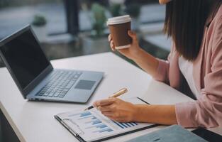 Finance manager meeting discussing company growth project success financial statistics, professional investor working start up project for strategy plan with document, laptop and digital tablet. photo