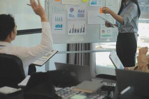 Business team collaboration discussing working analyzing with financial data and marketing growth report graph in team, presentation and brainstorming to strategy planning making profit of company. photo