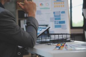 Close up ux developer and ui designer use augmented reality brainstorming about mobile app interface wireframe design on desk at modern office.Creative digital development agency photo