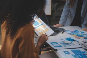 Close up ux developer and ui designer use augmented reality brainstorming about mobile app interface wireframe design on desk at modern office.Creative digital development agency photo