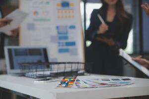 Close up ux developer and ui designer use augmented reality brainstorming about mobile app interface wireframe design on desk at modern office.Creative digital development agency photo