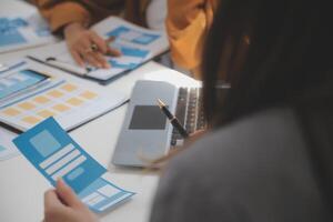 Close up ux developer and ui designer use augmented reality brainstorming about mobile app interface wireframe design on desk at modern office.Creative digital development agency photo