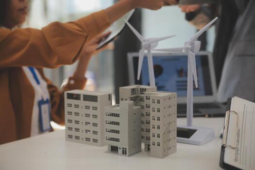 Electrical engineer with businessman discussing new project installation solar cell panel on the roof of building. Alternative energy concept. photo