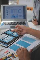 Close up ux developer and ui designer use augmented reality brainstorming about mobile app interface wireframe design on desk at modern office.Creative digital development agency photo