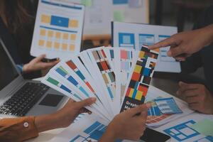 Close up ux developer and ui designer use augmented reality brainstorming about mobile app interface wireframe design on desk at modern office.Creative digital development agency photo