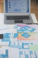 Close up ux developer and ui designer use augmented reality brainstorming about mobile app interface wireframe design on desk at modern office.Creative digital development agency photo