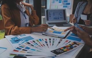 Close up ux developer and ui designer use augmented reality brainstorming about mobile app interface wireframe design on desk at modern office.Creative digital development agency photo