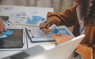 Close up ux developer and ui designer use augmented reality brainstorming about mobile app interface wireframe design on desk at modern office.Creative digital development agency photo