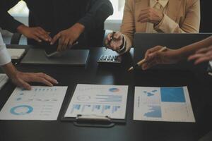 Business team collaboration discussing working analyzing with financial data and marketing growth report graph in team, presentation and brainstorming to strategy planning making profit of company. photo