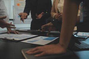 Business team collaboration discussing working analyzing with financial data and marketing growth report graph in team, presentation and brainstorming to strategy planning making profit of company. photo