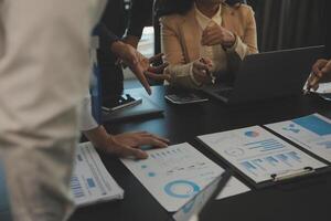 Business team collaboration discussing working analyzing with financial data and marketing growth report graph in team, presentation and brainstorming to strategy planning making profit of company. photo