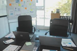 Laptop on a desk in an open financial office. photo