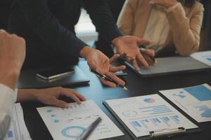 Business team collaboration discussing working analyzing with financial data and marketing growth report graph in team, presentation and brainstorming to strategy planning making profit of company. photo