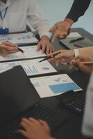 Business team collaboration discussing working analyzing with financial data and marketing growth report graph in team, presentation and brainstorming to strategy planning making profit of company. photo