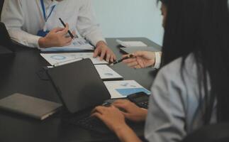 Business team collaboration discussing working analyzing with financial data and marketing growth report graph in team, presentation and brainstorming to strategy planning making profit of company. photo