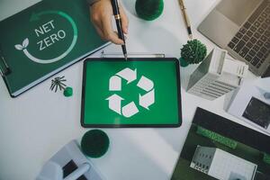 Carbon offset price report CO2 emission. Future growth Net zero waste in ESG ethical SME office protect climate change global warming social issues project. Group of asia people Eco friendly SDGs plan photo